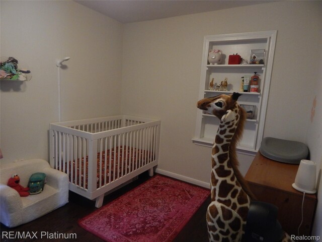 22133 Rosedale St, Saint Clair Shores, MI 48080 - bedroom with wood finished floors and a nursery area