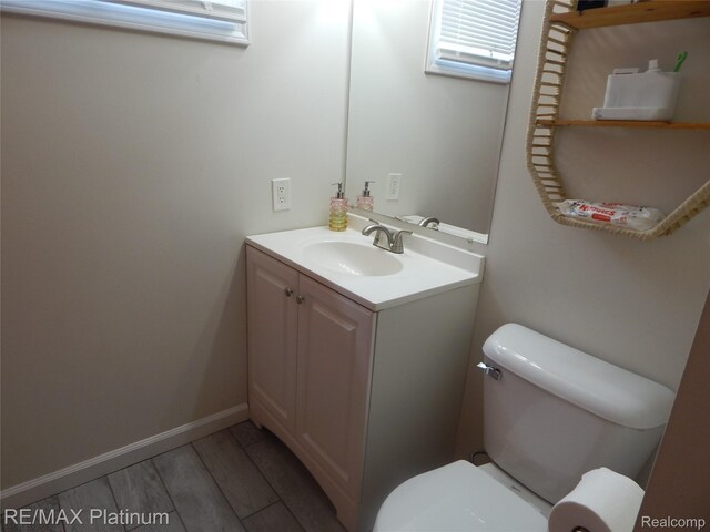 22133 Rosedale St, Saint Clair Shores, MI 48080 - half bathroom featuring vanity and wood finished floors