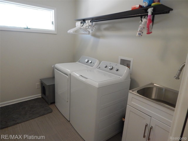 22133 Rosedale St, Saint Clair Shores, MI 48080 - laundry area with washing machine and dryer and cabinet space