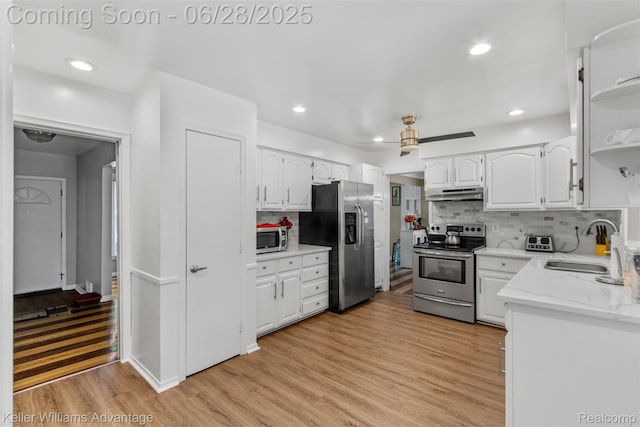 21415 Lathrup St, Southfield, MI 48075 - kitchen featuring stainless steel appliances, white cabinetry, open shelves, tasteful backsplash, and recessed lighting