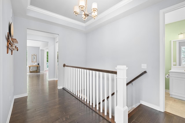 636 Wynding Oaks, Kalamazoo, MI 49006 - hall with an upstairs landing, a chandelier, hardwood / wood-style flooring, ornamental molding, and a tray ceiling