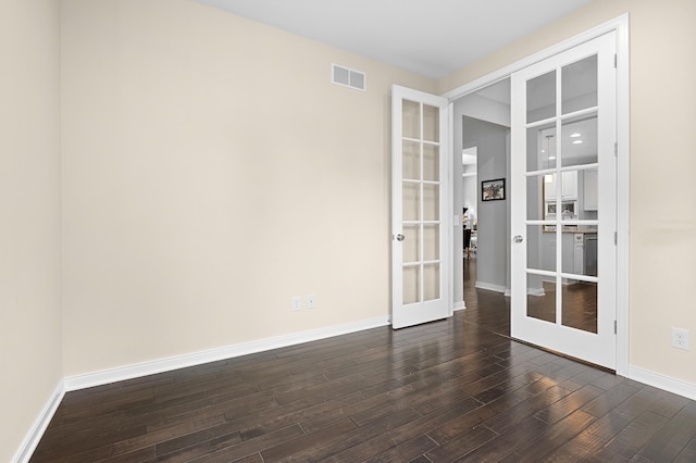 636 Wynding Oaks, Kalamazoo, MI 49006 - empty room with french doors and dark wood-style floors