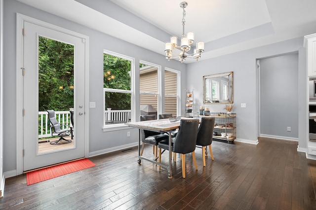 636 Wynding Oaks, Kalamazoo, MI 49006 - dining room with a chandelier, healthy amount of natural light, and dark wood-type flooring