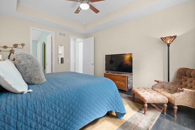 636 Wynding Oaks, Kalamazoo, MI 49006 - bedroom with wood finished floors, ceiling fan, arched walkways, and a raised ceiling