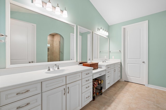 636 Wynding Oaks, Kalamazoo, MI 49006 - full bathroom with vanity, tiled shower, and lofted ceiling