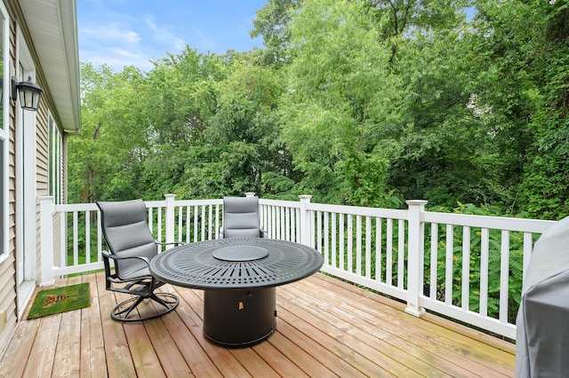 636 Wynding Oaks, Kalamazoo, MI 49006 - wooden deck featuring view of wooded area