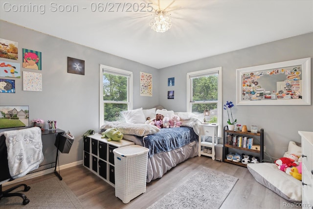 1453 Maplewood Dr, Saline, MI 48176 - bedroom with multiple windows and wood finished floors