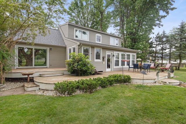 9708 Oakland Dr, Portage, MI 49024 - rear view of house featuring a wooden deck, a yard, french doors, and roof with shingles