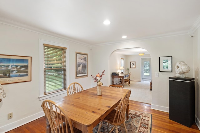 9708 Oakland Dr, Portage, MI 49024 - dining room with arched walkways, ornamental molding, wood finished floors, and recessed lighting