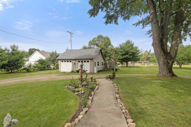 9708 Oakland Dr, Portage, MI 49024 - view of front of property featuring an outbuilding, driveway, a detached garage, and roof with shingles