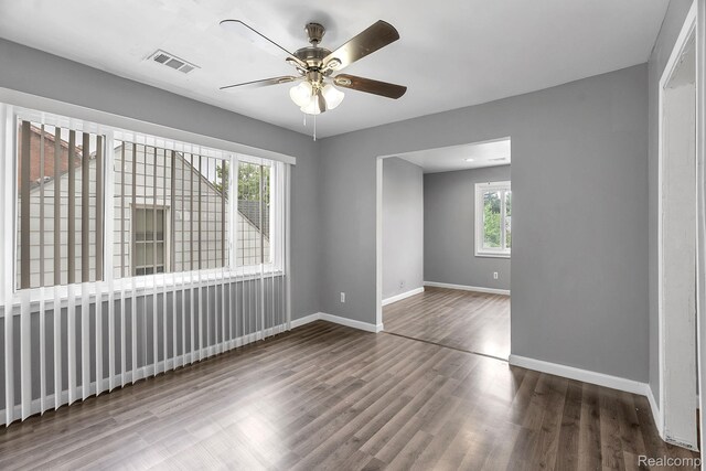 15852 Washburn St, Dearborn, MI 48238 - empty room with wood finished floors and ceiling fan