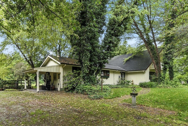 8454 Stickles Rd, Three Oaks, MI 49128 - view of front of home featuring a front lawn and roof with shingles