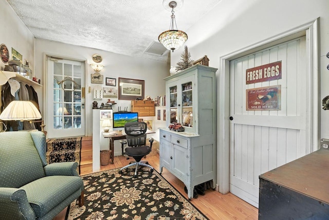 8454 Stickles Rd, Three Oaks, MI 49128 - office featuring light wood-style flooring and a textured ceiling