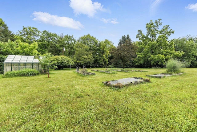 8454 Stickles Rd, Three Oaks, MI 49128 - view of green lawn with a greenhouse and an outdoor structure