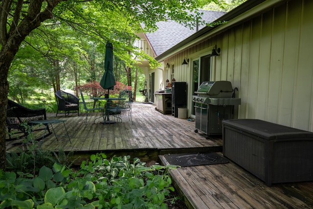 8454 Stickles Rd, Three Oaks, MI 49128 - deck with a grill and outdoor dining space