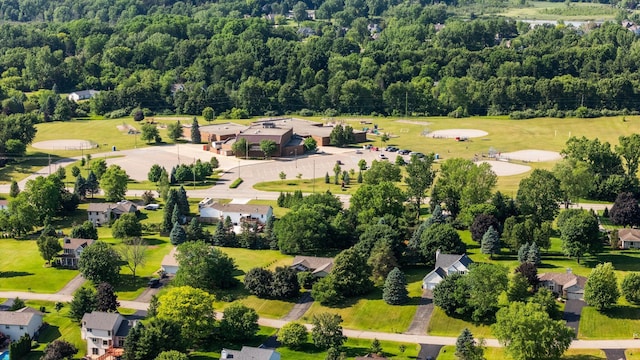 3395 Simsbury Dr, Pinckney, MI 48169 - aerial view of residential area with a heavily wooded area