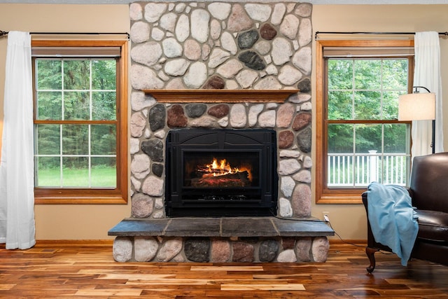 3395 Simsbury Dr, Pinckney, MI 48169 - detailed view of wood finished floors and a stone fireplace