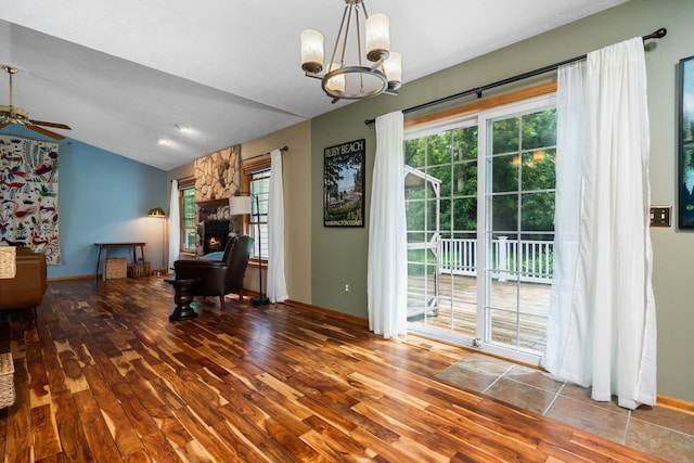 3395 Simsbury Dr, Pinckney, MI 48169 - dining room with hardwood / wood-style flooring, ceiling fan, plenty of natural light, a chandelier, and lofted ceiling