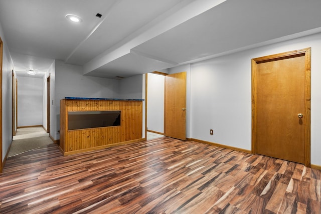 3395 Simsbury Dr, Pinckney, MI 48169 - unfurnished living room featuring wood finished floors and recessed lighting