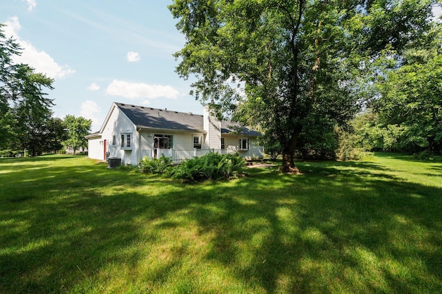 3395 Simsbury Dr, Pinckney, MI 48169 - view of grassy yard with a wooden deck