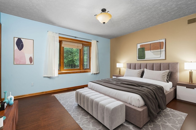 3395 Simsbury Dr, Pinckney, MI 48169 - bedroom with wood finished floors and a textured ceiling