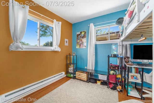 29038 Spoon Ave, Madison Heights, MI 48071 - bedroom featuring a baseboard heating unit and wood finished floors