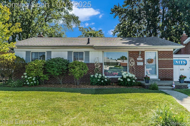 29038 Spoon Ave, Madison Heights, MI 48071 - view of front of property featuring a front yard and brick siding
