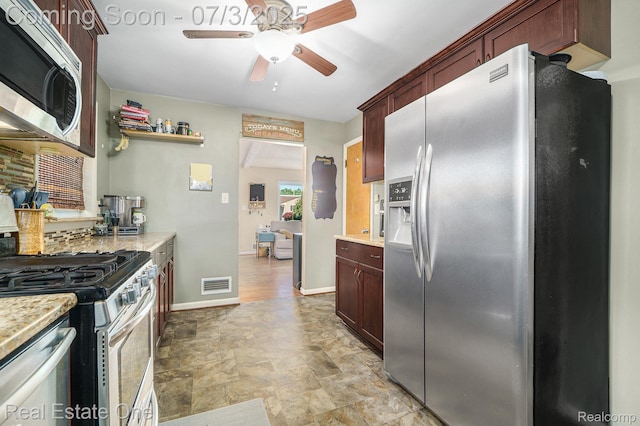 29038 Spoon Ave, Madison Heights, MI 48071 - kitchen with appliances with stainless steel finishes, ceiling fan, and stone finish floors