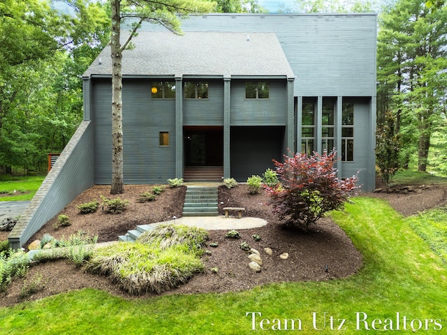 410 Greentree Ln NE, Ada, MI 49301 - view of front of property with a shingled roof