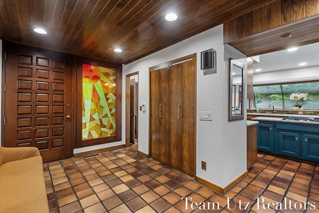 410 Greentree Ln NE, Ada, MI 49301 - entrance foyer with recessed lighting and wooden ceiling