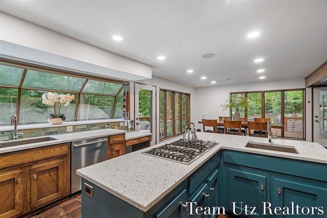 410 Greentree Ln NE, Ada, MI 49301 - kitchen featuring stainless steel appliances, recessed lighting, and light stone countertops