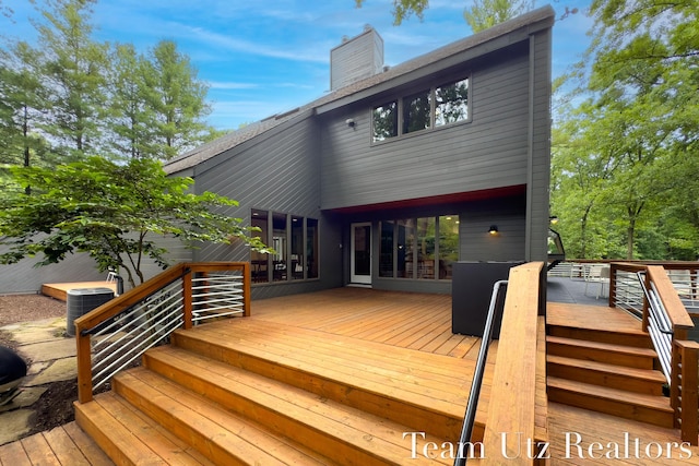 410 Greentree Ln NE, Ada, MI 49301 - view of wooden deck
