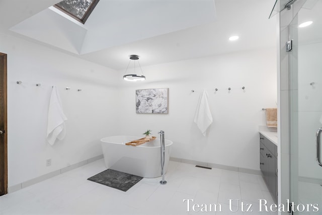 410 Greentree Ln NE, Ada, MI 49301 - full bathroom featuring a skylight, vanity, a soaking tub, recessed lighting, and a shower
