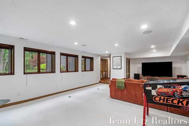 410 Greentree Ln NE, Ada, MI 49301 - living area featuring light colored carpet and recessed lighting