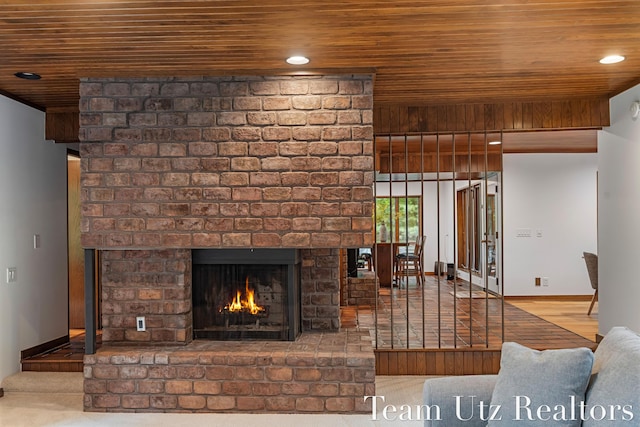 410 Greentree Ln NE, Ada, MI 49301 - living area with wood ceiling, a brick fireplace, and recessed lighting