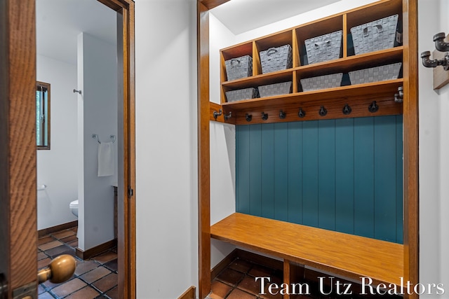 410 Greentree Ln NE, Ada, MI 49301 - mudroom with tile patterned flooring and baseboards