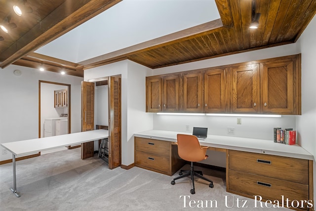 410 Greentree Ln NE, Ada, MI 49301 - office area with built in desk, a wood ceiling with exposed beams, washing machine and clothes dryer, and light carpet