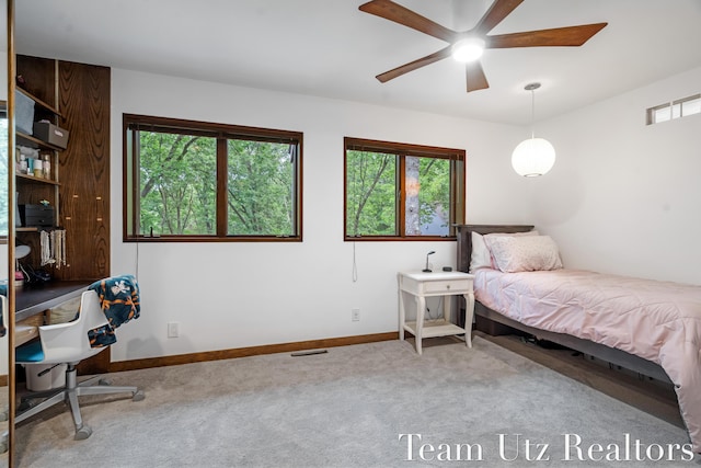 410 Greentree Ln NE, Ada, MI 49301 - bedroom with carpet, multiple windows, and an office area