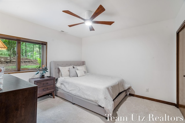 410 Greentree Ln NE, Ada, MI 49301 - bedroom with carpet flooring and ceiling fan