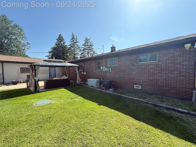 53240 Odilon Ave, Shelby Twp, MI 48316 - rear view of property with a gazebo, brick siding, a yard, and a chimney