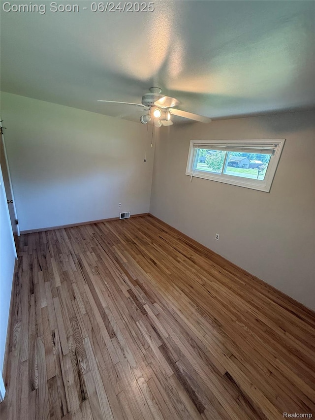 53240 Odilon Ave, Shelby Twp, MI 48316 - spare room featuring wood finished floors and a ceiling fan