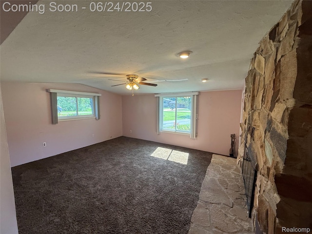 53240 Odilon Ave, Shelby Twp, MI 48316 - unfurnished room with a ceiling fan, dark colored carpet, a textured ceiling, and vaulted ceiling