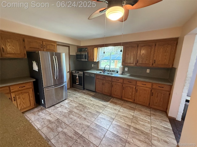 53240 Odilon Ave, Shelby Twp, MI 48316 - kitchen featuring appliances with stainless steel finishes, a ceiling fan, and brown cabinetry