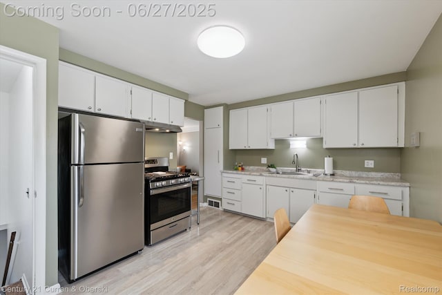 11769 Eileen, Redford, MI 48239 - kitchen featuring stainless steel appliances, light wood-style floors, light countertops, and white cabinets
