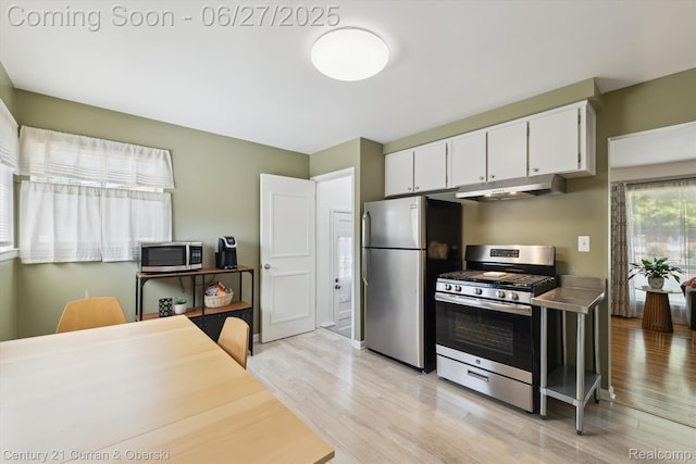 11769 Eileen, Redford, MI 48239 - kitchen with stainless steel appliances, light wood-type flooring, white cabinets, and under cabinet range hood