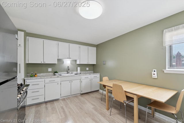 11769 Eileen, Redford, MI 48239 - kitchen featuring stainless steel gas range, light wood-style floors, and white cabinetry