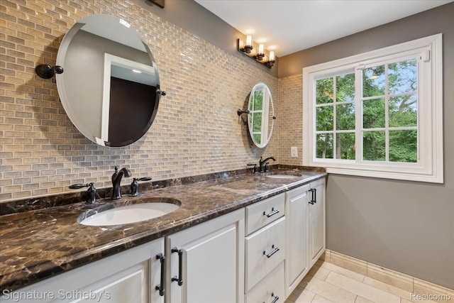 4438 Stony River Dr, Bloomfield Hills, MI 48301 - bathroom with tasteful backsplash, double vanity, and tile patterned flooring