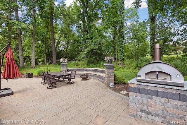 4438 Stony River Dr, Bloomfield Hills, MI 48301 - view of patio featuring outdoor dining area and view of wooded area