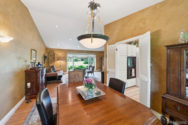 2650 Binbrooke Dr, Troy, MI 48084 - dining area featuring high vaulted ceiling and baseboards