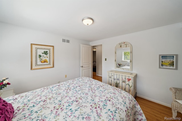 2650 Binbrooke Dr, Troy, MI 48084 - bedroom featuring wood finished floors and baseboards